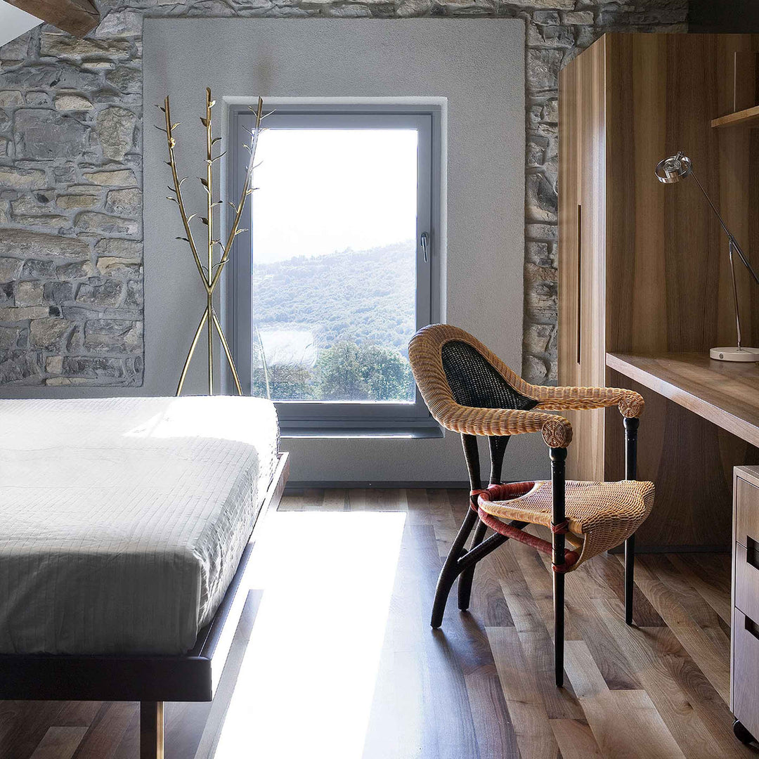 Liba rattan chair by Borek Sipek for Driade, sculptural designer seating in woven rattan with Acate clothes hanger