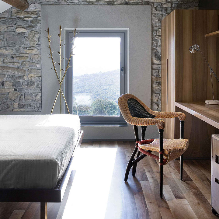 Liba rattan chair by Borek Sipek for Driade, sculptural designer seating in woven rattan with Acate clothes hanger