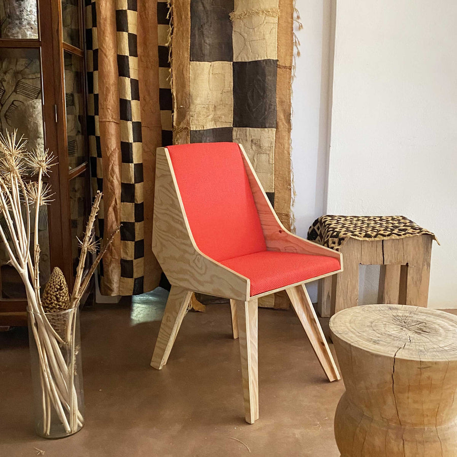 Cardillo Red chair by Jules Regis, phenolic CLT structure with red fabric upholstery, contemporary designer seating indoors