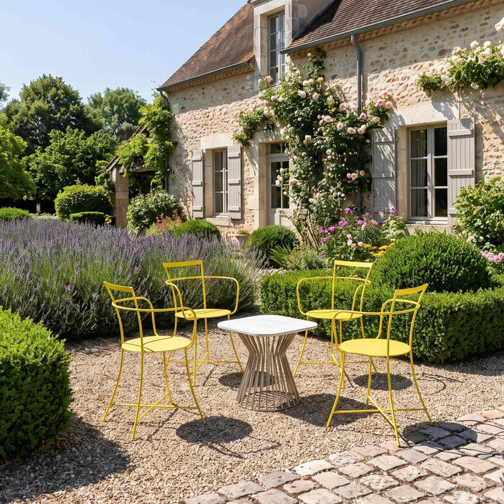 yellow armchairs irma in a garden of a country house