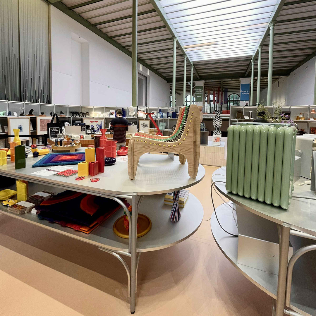 Spider chair by Jules Regis, oak wood structure with braided multicolor boat rope seating, contemporary designer chair in a shop
