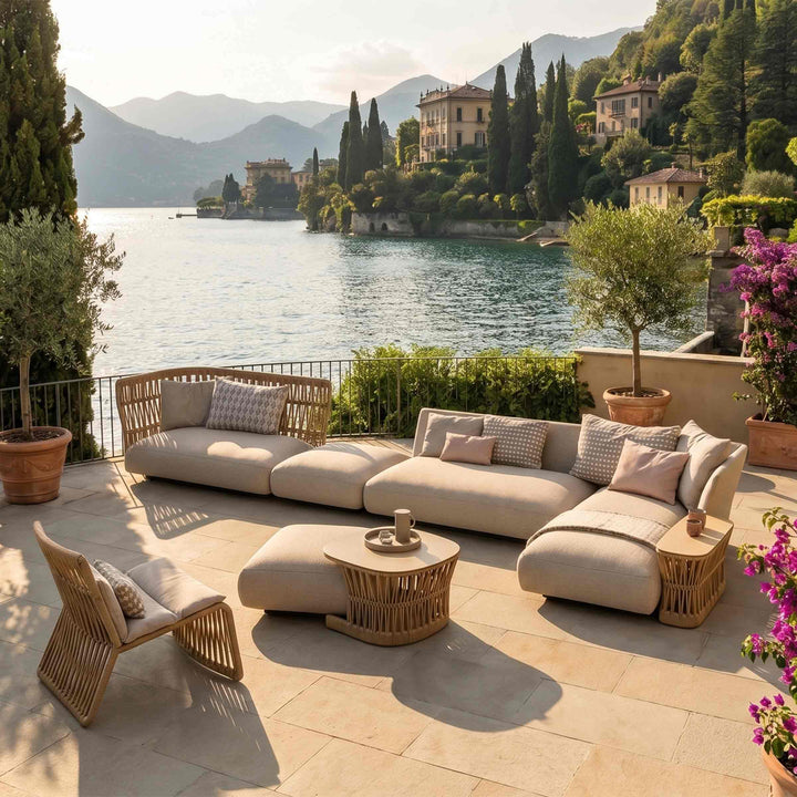 beige outdoor sofa cliff by talenti with woven accents on a scenic lakeside patio