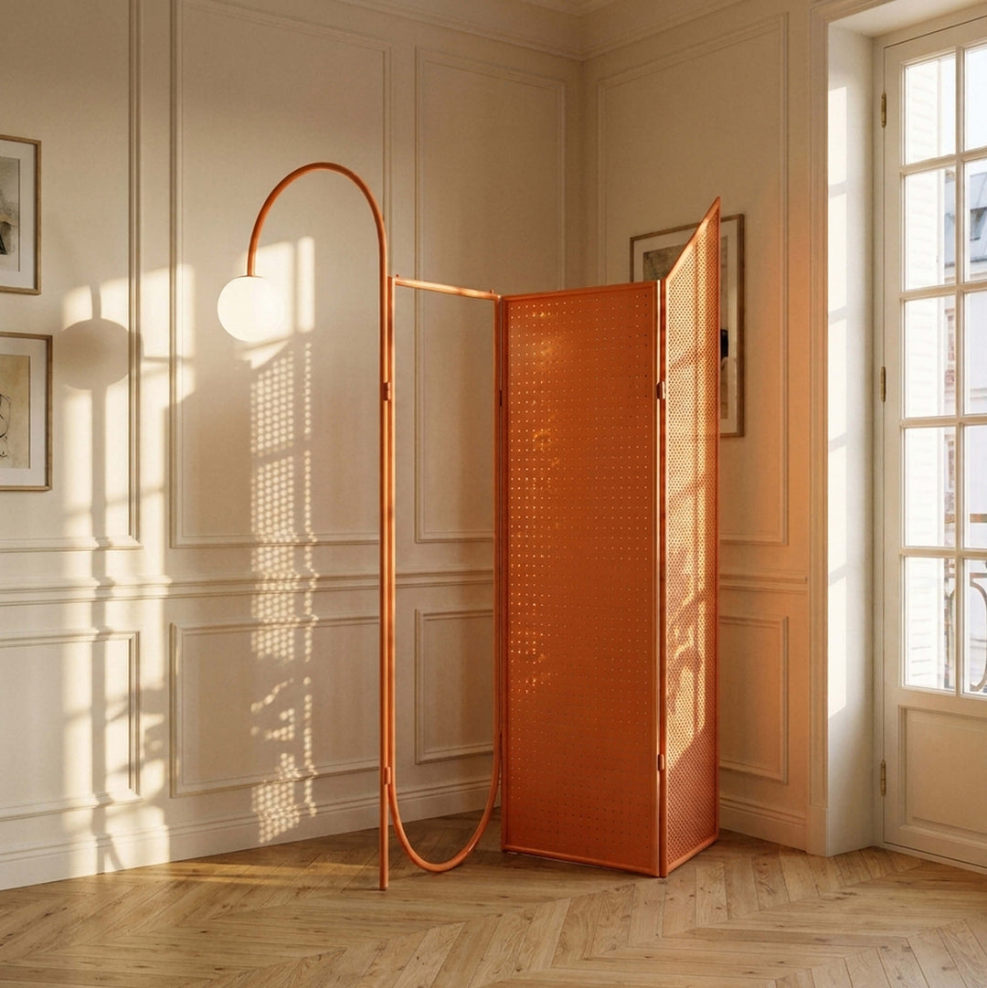 Giacopini DEJA-VU 01 melon room divider with perforated folding panels and a curved frame holding a globe light