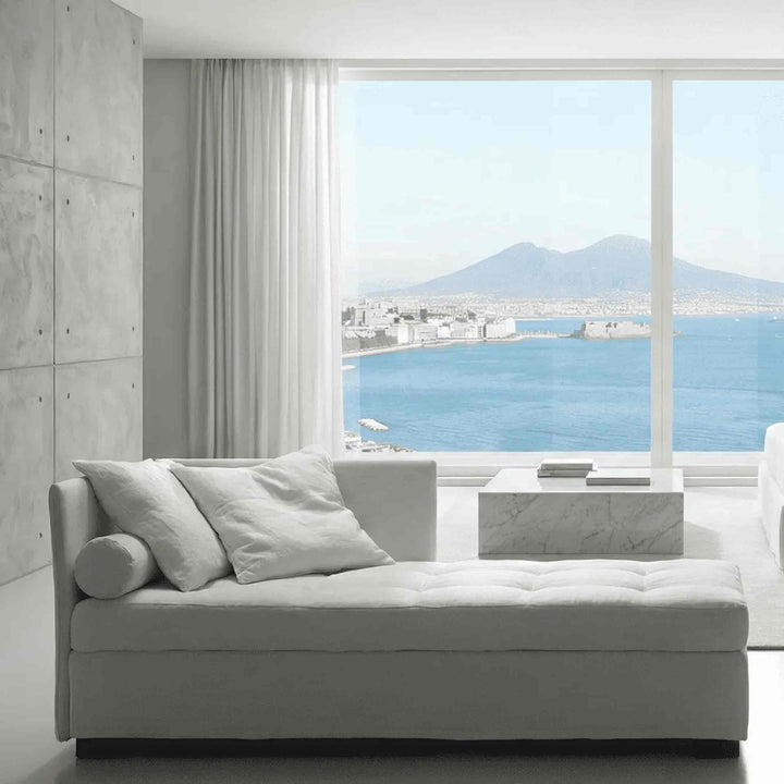 white Storage Sofa Bed ISOLINO by Orizzonti Design Center for Horm infront of glassdoors