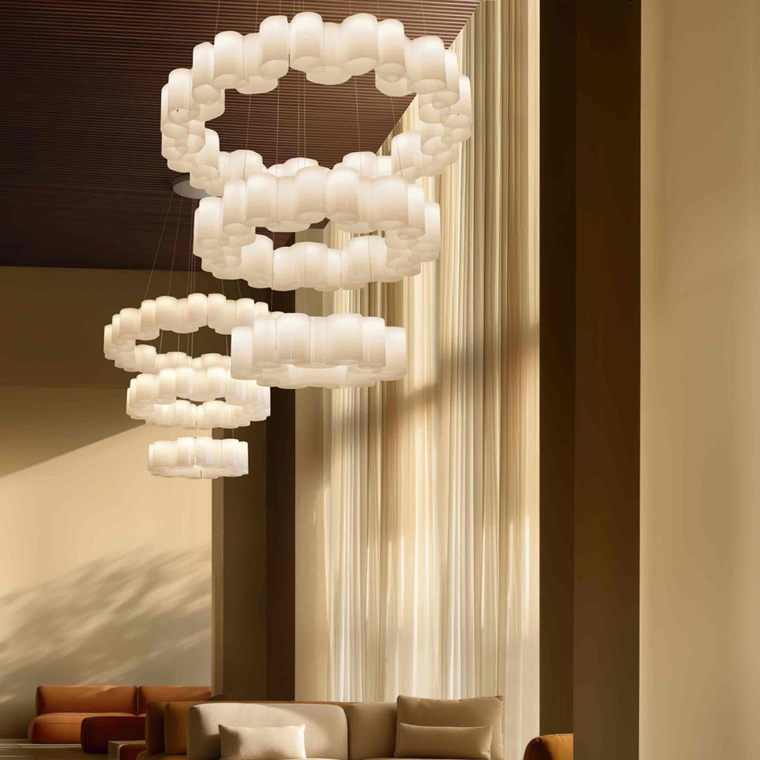 White circular suspension lamp honey by stilnovo hanging in a contemporary interior