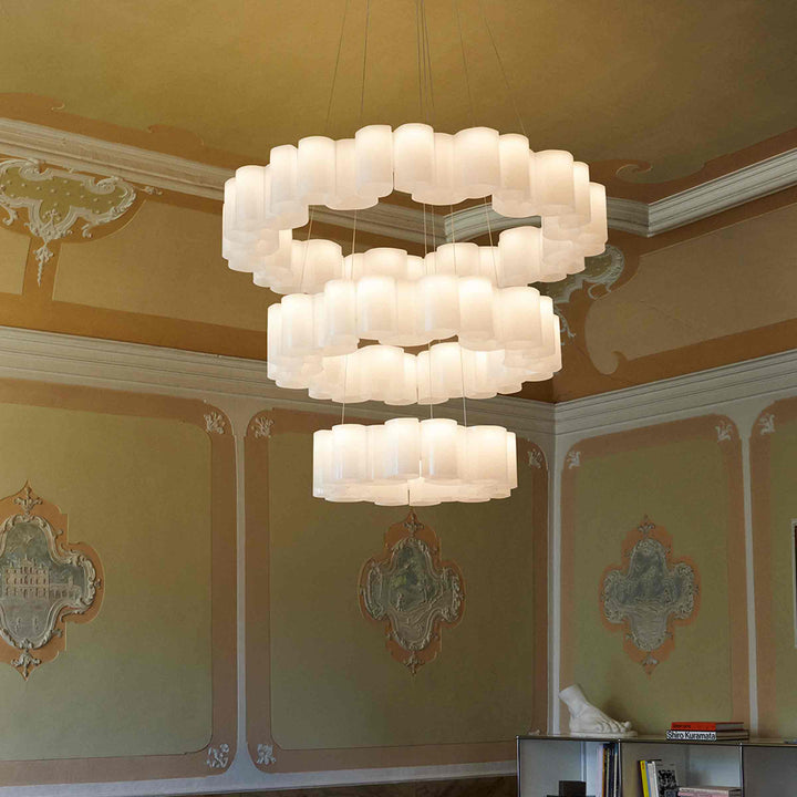 White circular suspension lamp honey by stilnovo hanging in a neoclassic interior