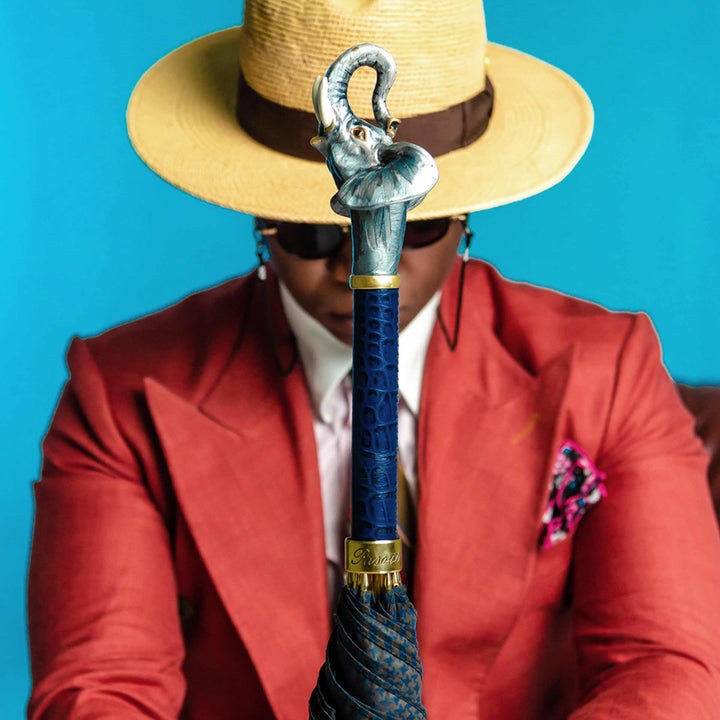 Elephant umbrella with enameled brass handle, luxury designer rain accessory.