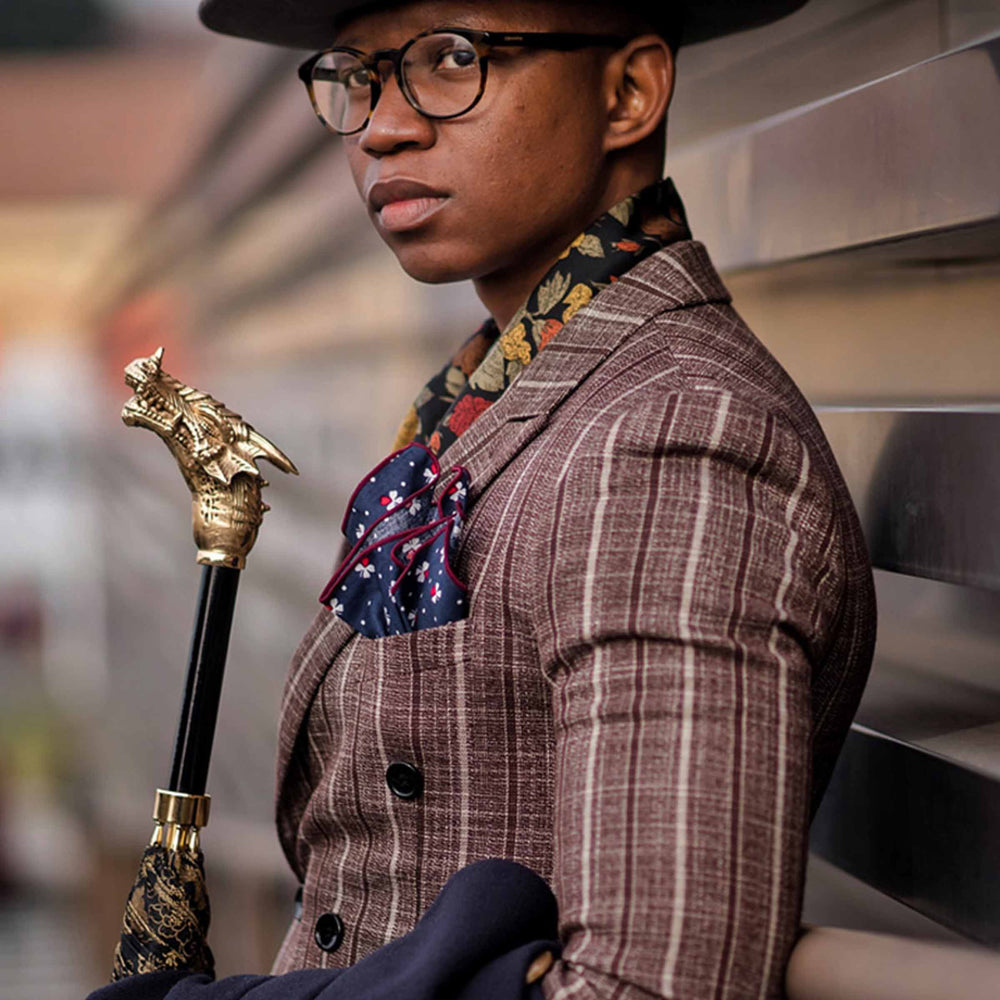 Golden Dragon umbrella with brass handle, luxury designer rain accessory.